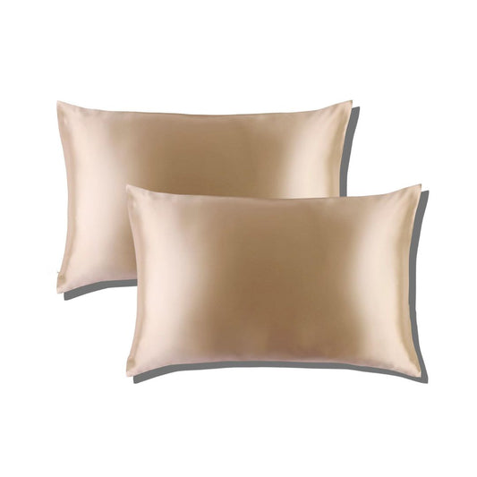 Two beige silk pillowcases placed one on top of the other.